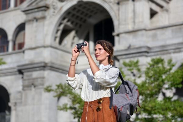 Solo woman traveller taking photo