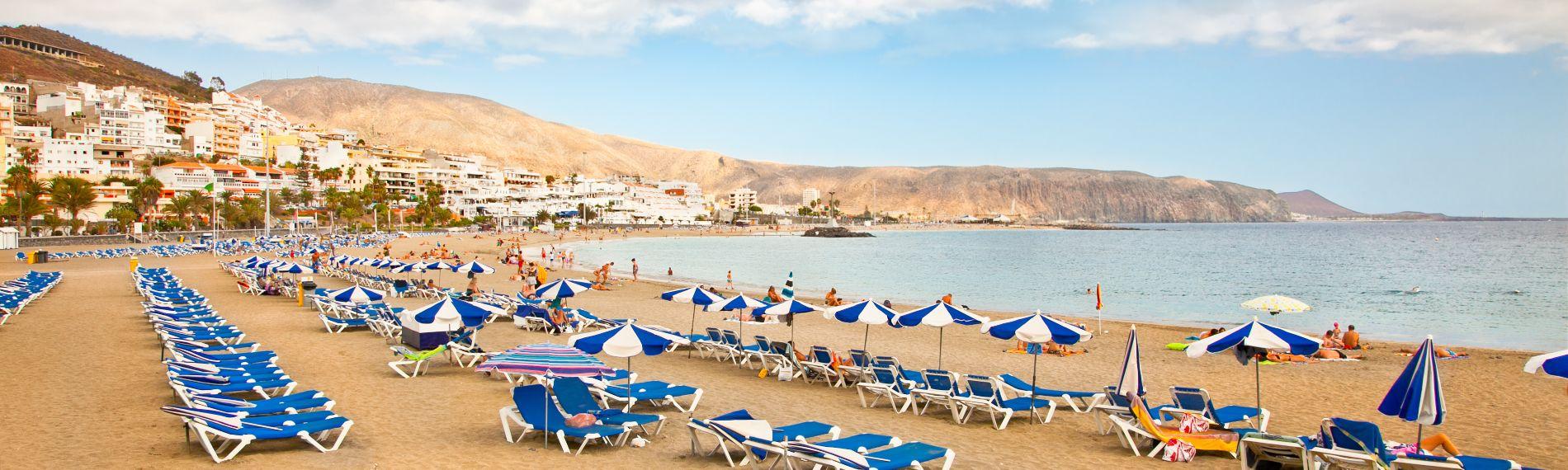 View along the gold sands of Los Cristianos Playa de las Vistas beach in Tenerife